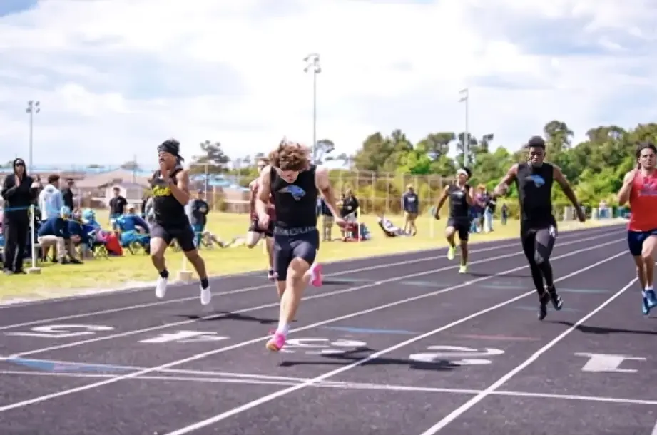 A group of people running on the track