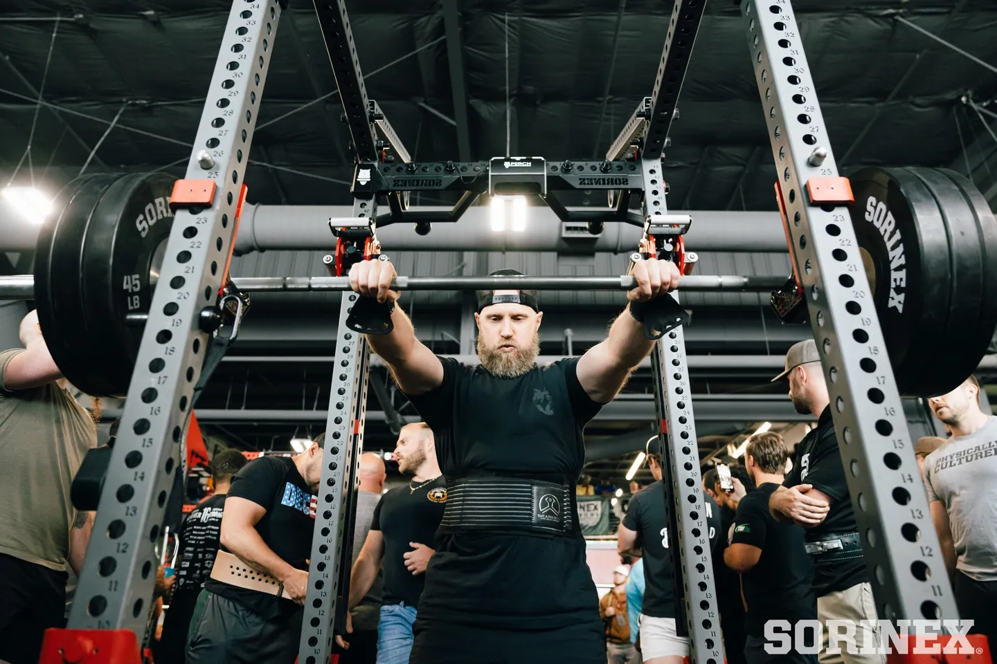 A man is lifting some weight in the gym