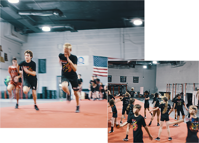 A group of young people playing frisbee in an indoor arena.